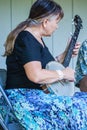 Female Playing a Banjo